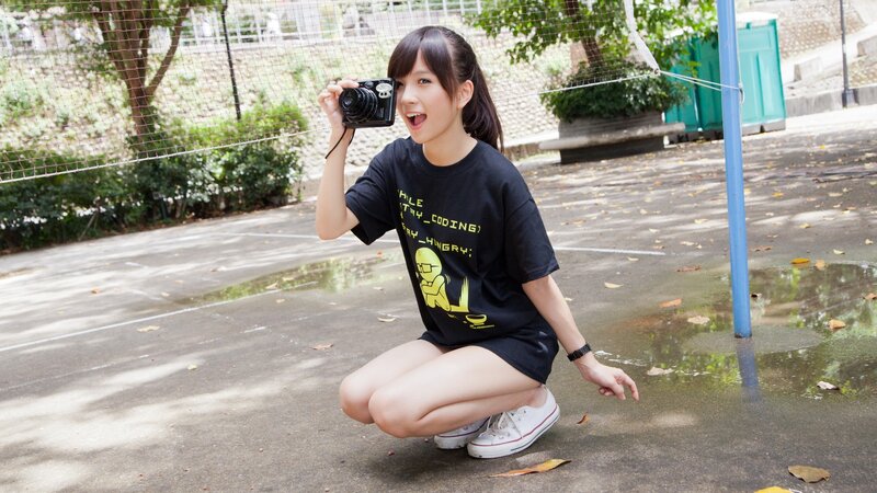 Girl taking a photo outdoors
