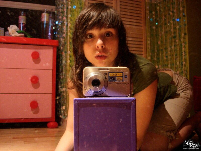 girl taking a photo with camera