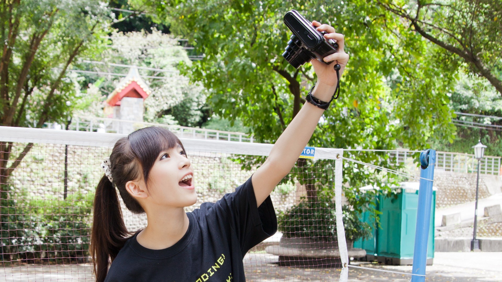 Girl taking a selfie with camera