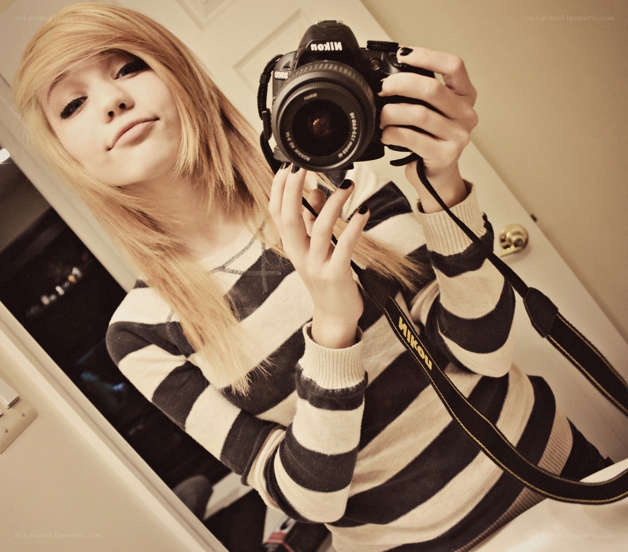 Girl taking mirror selfie with camera