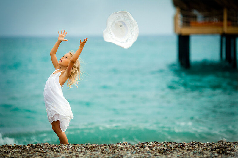 Girl Throwing Hat