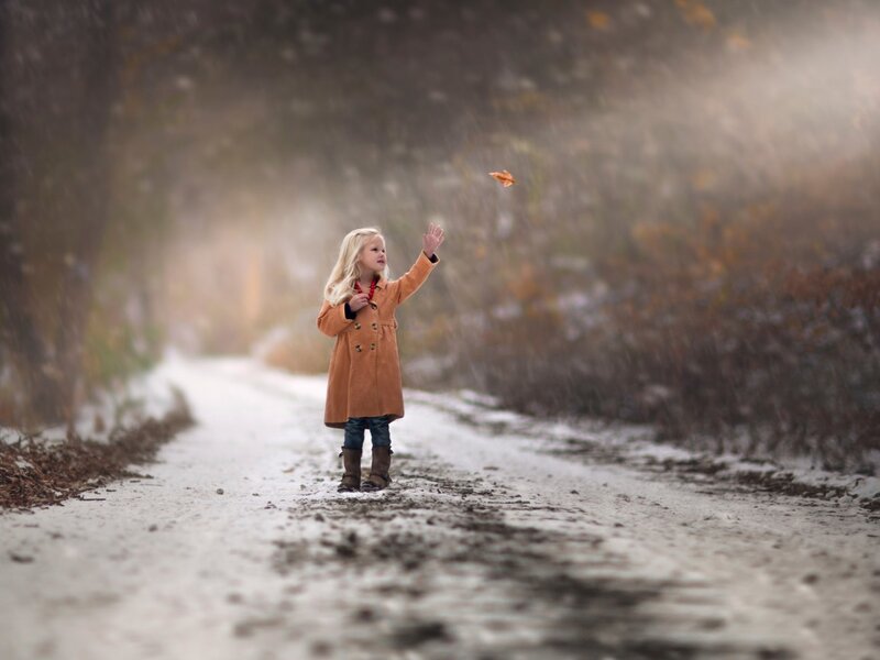 Girl Throwing Leaf