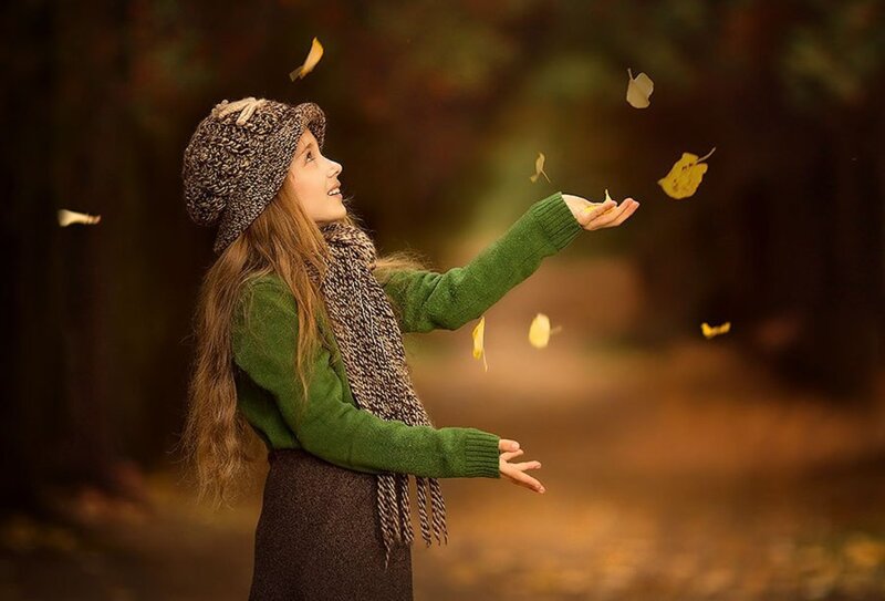 Girl Throwing Leaves