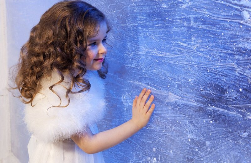 Girl Touching Ice Wall