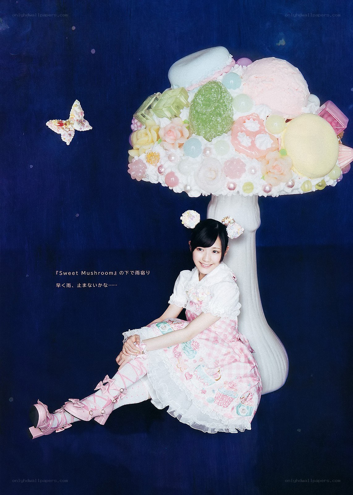 Girl under a sweet mushroom