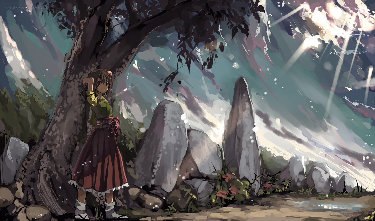 Girl under a tree in a forest
