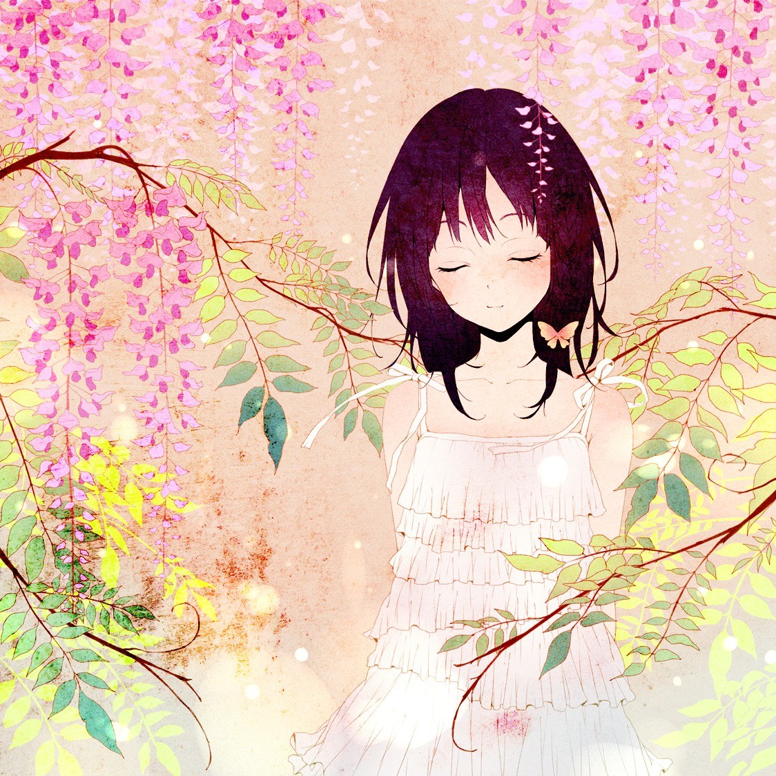Girl under wisteria blossoms