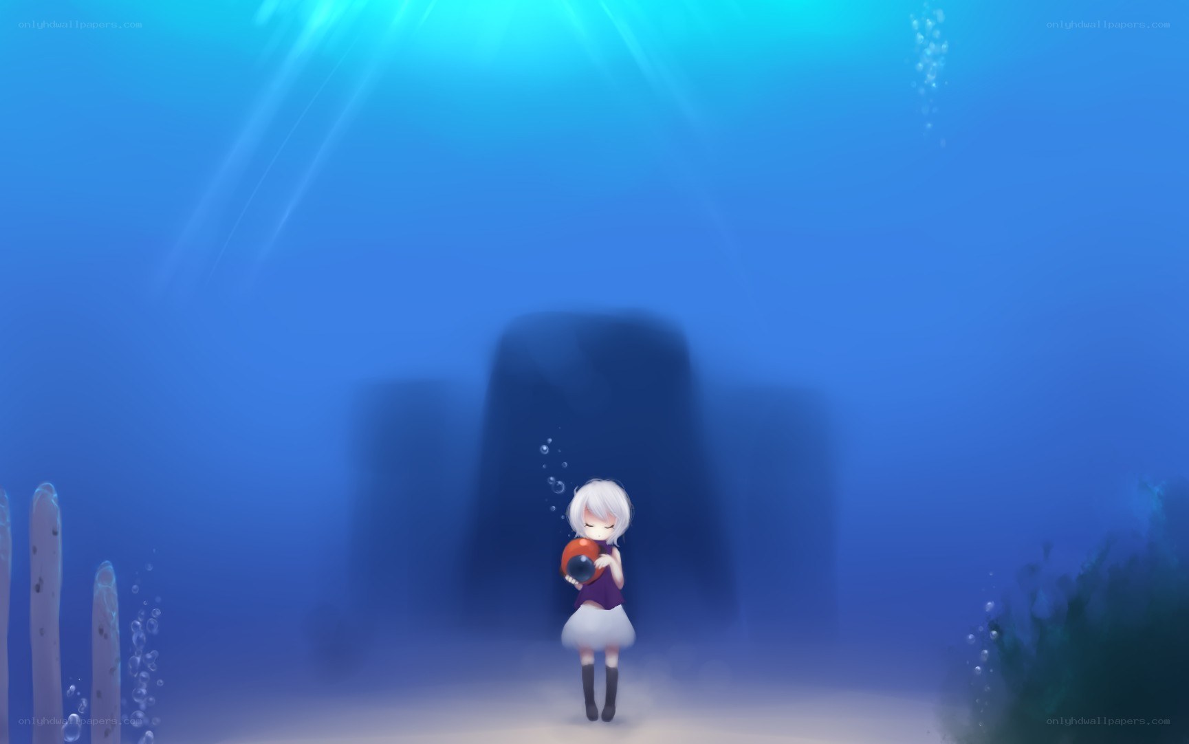 girl underwater with orb
