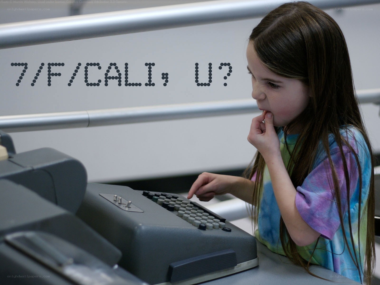 girl using old computer terminal