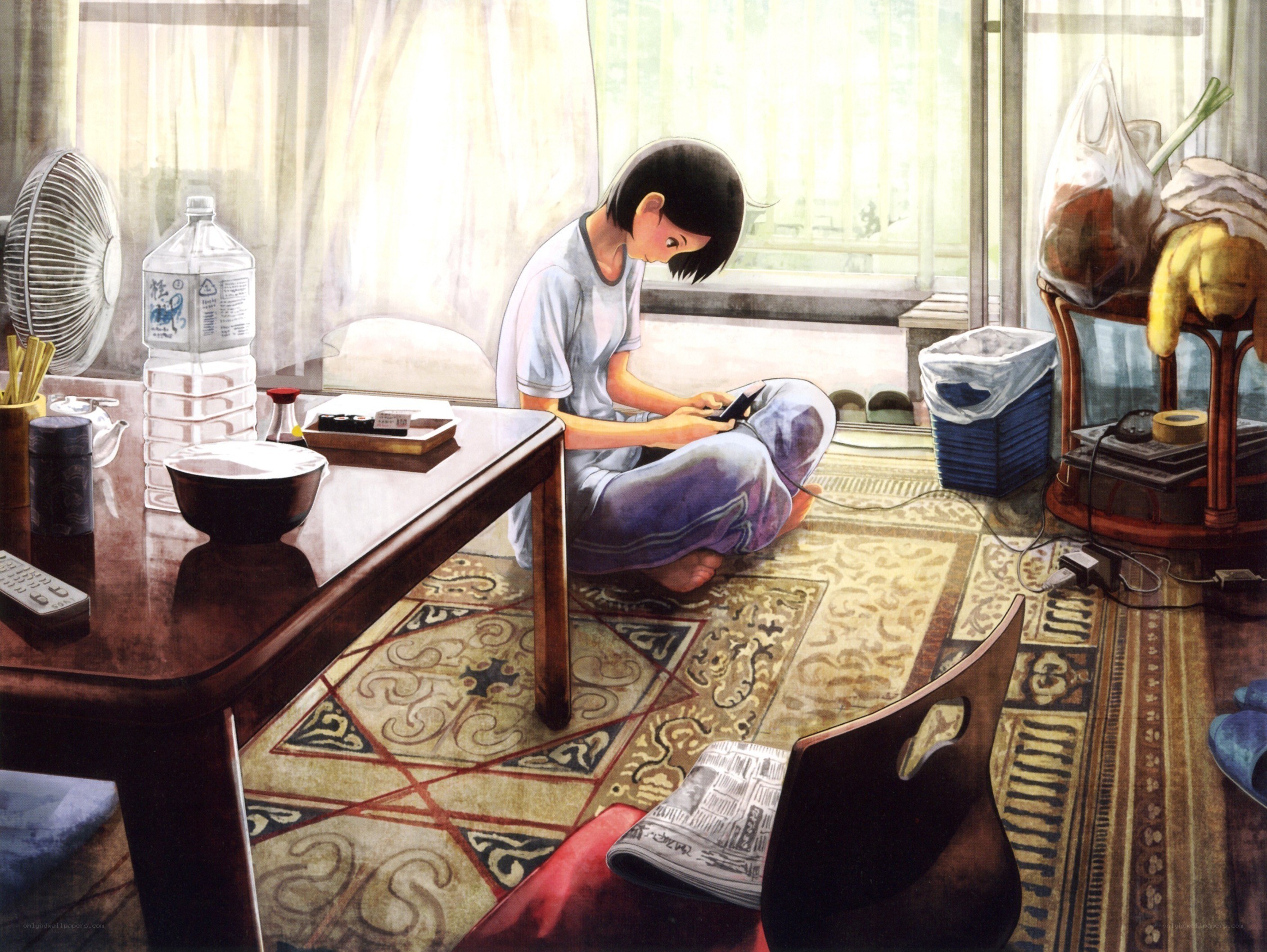 Girl using phone on floor