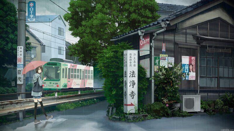Girl walking in the rain with a tram