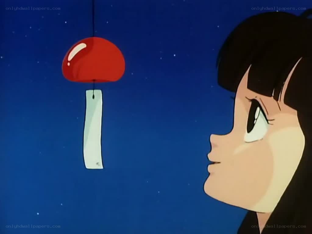girl watching a wind chime