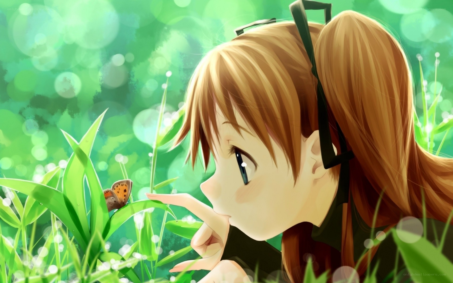 girl watching butterfly in grass