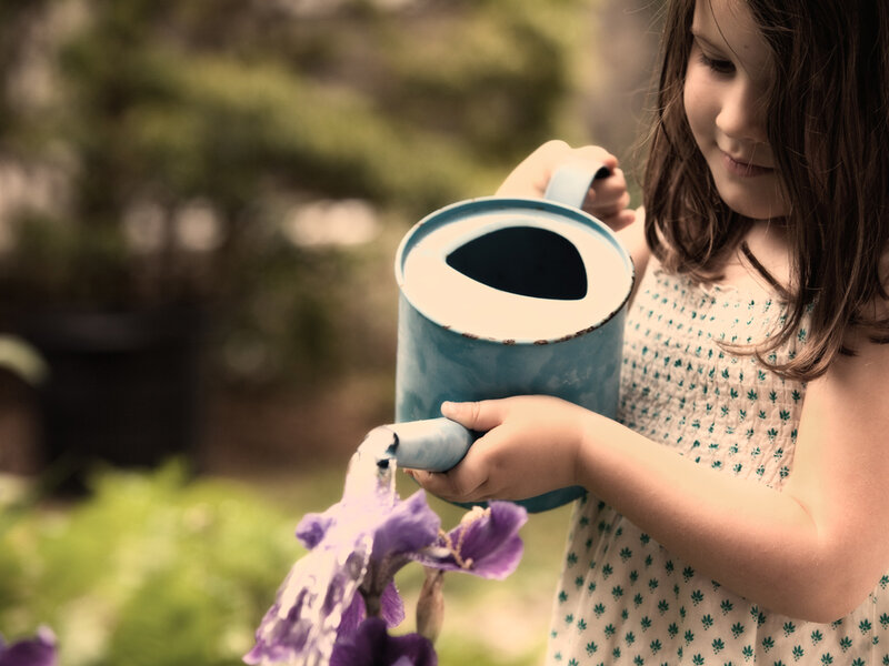 Girl Watering Flower