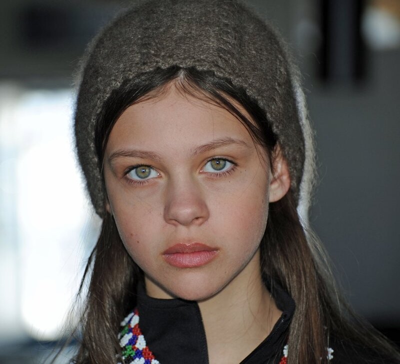 girl wearing a beaded necklace