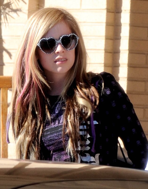 girl wearing heart sunglasses