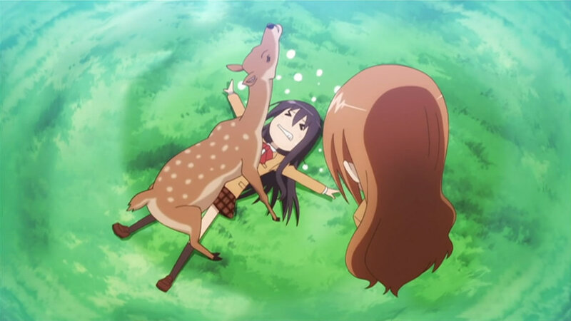 Girl with a deer in the forest
