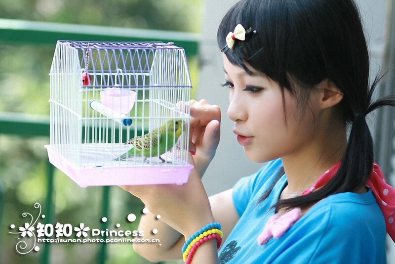 Girl with a pet bird