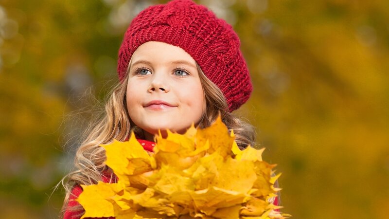 Girl with autumn leaves