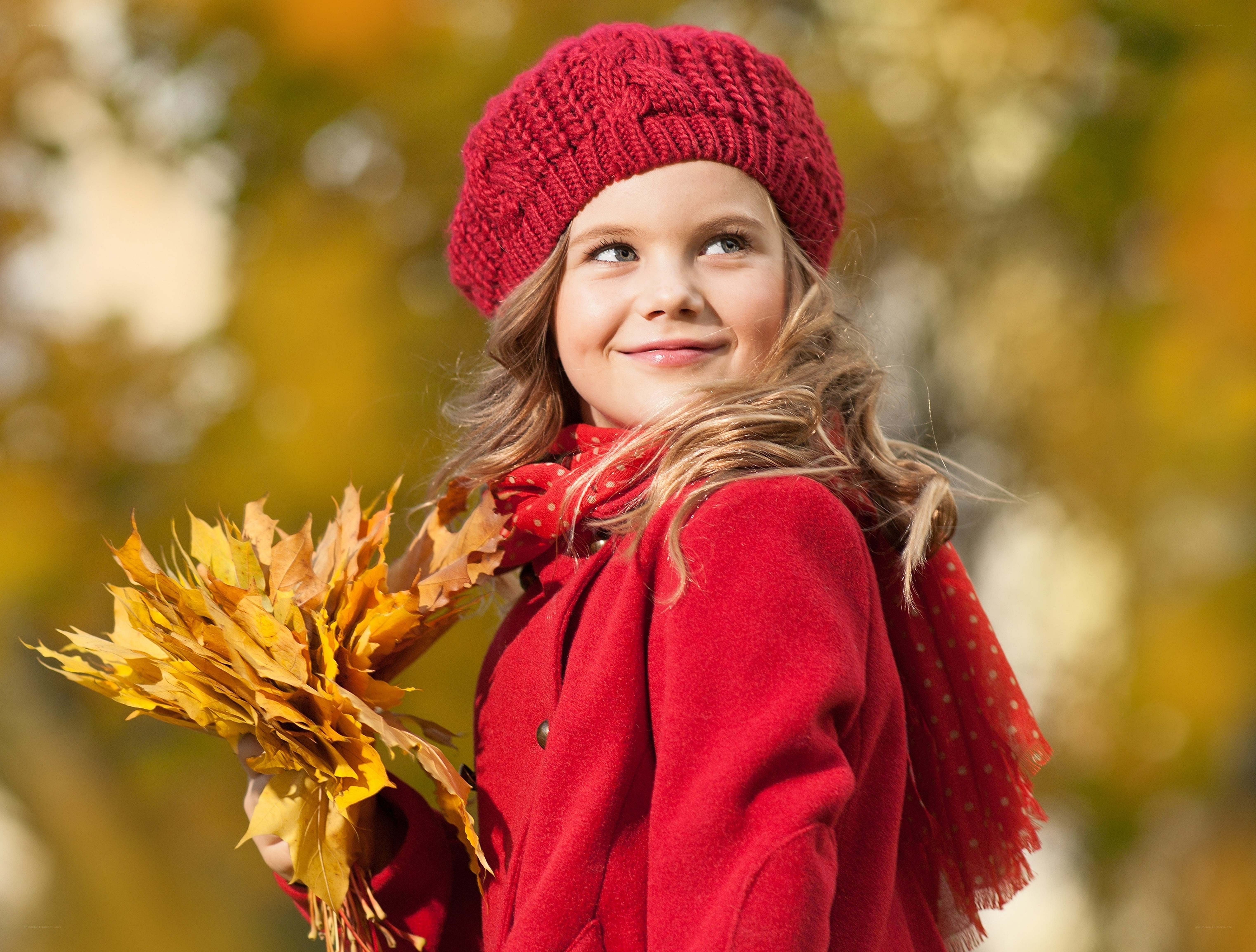 Girl with autumn leaves