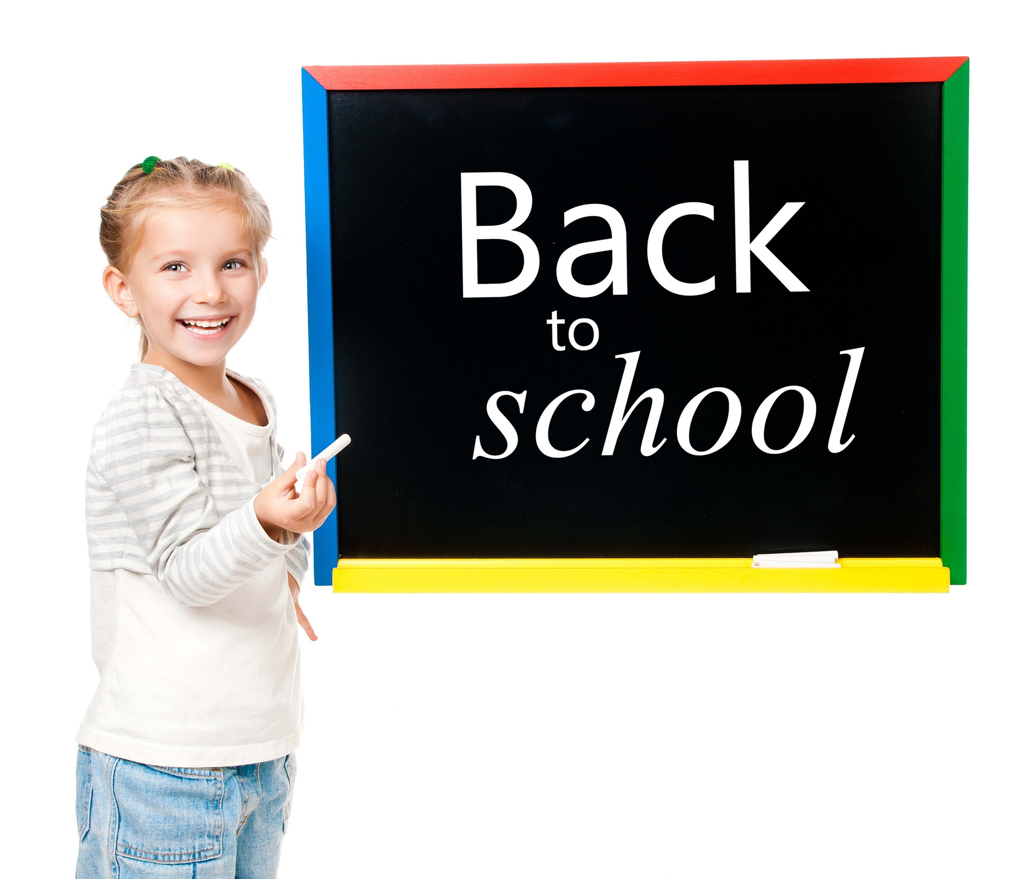 girl with back to school sign