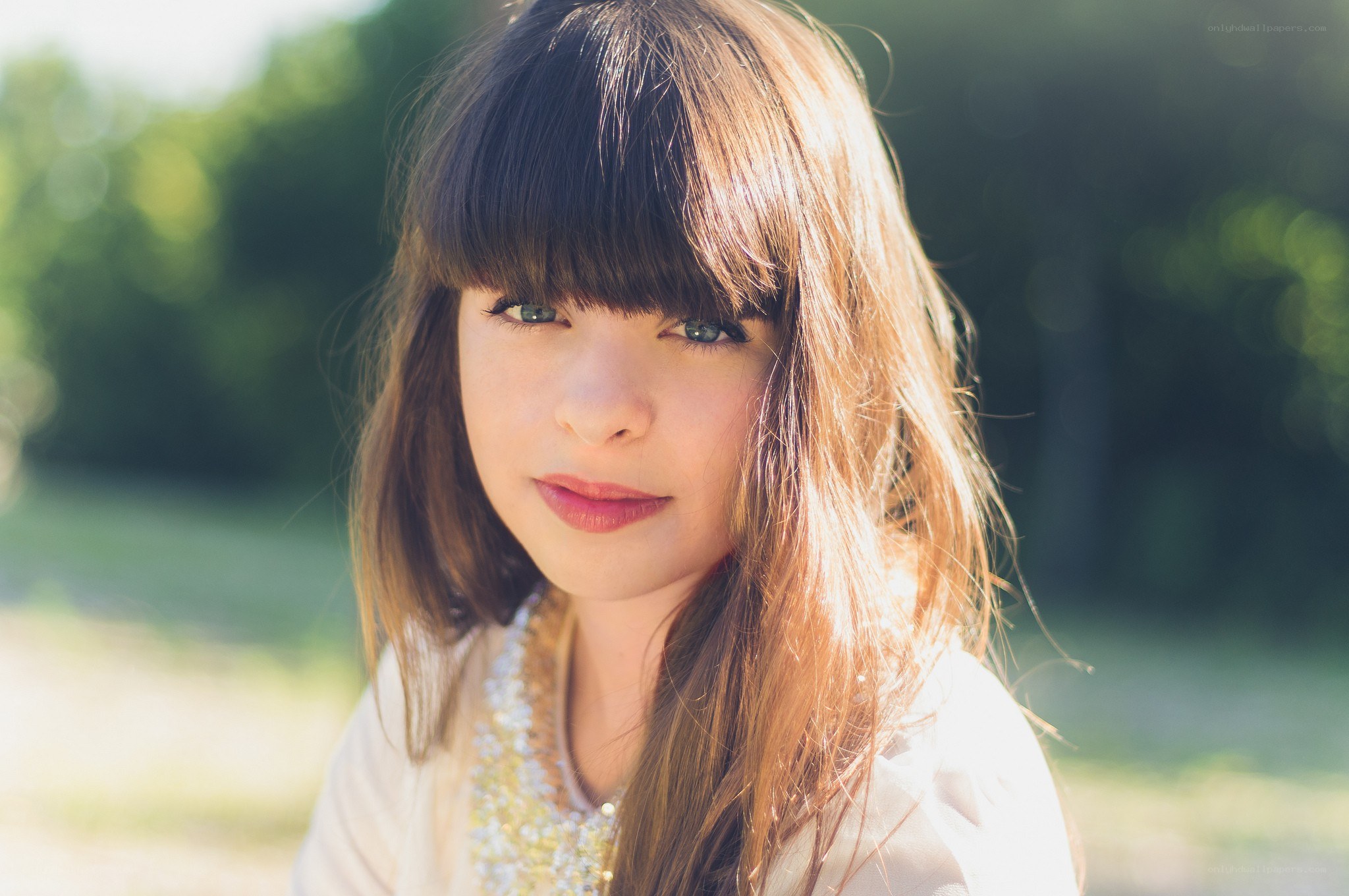 girl with bangs in sunlight