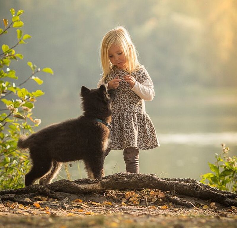 Girl with Black Puppy