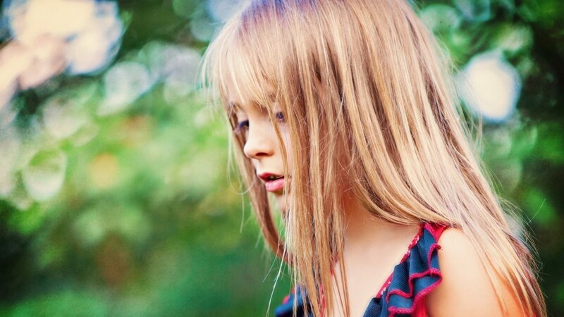 girl with blonde hair outdoors