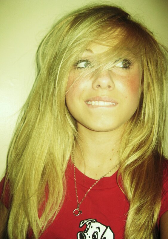girl with blonde hair smiling