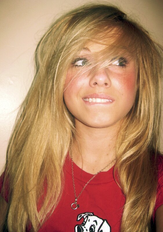 girl with blonde hair smiling