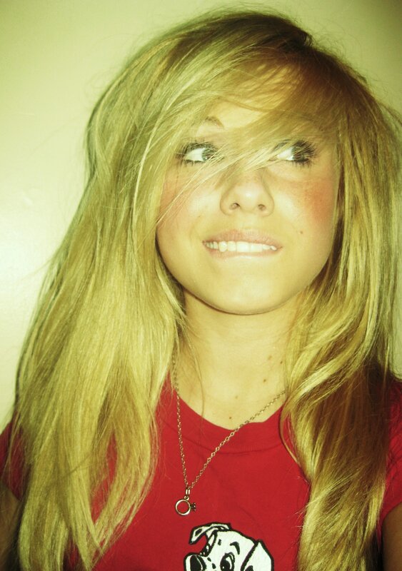 girl with blonde hair smiling