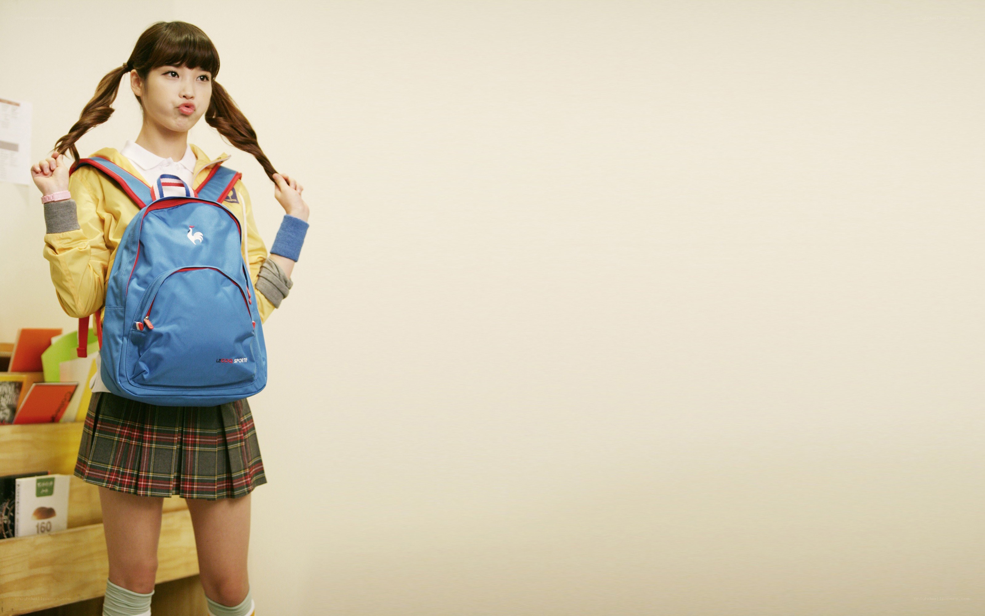 girl with blue backpack