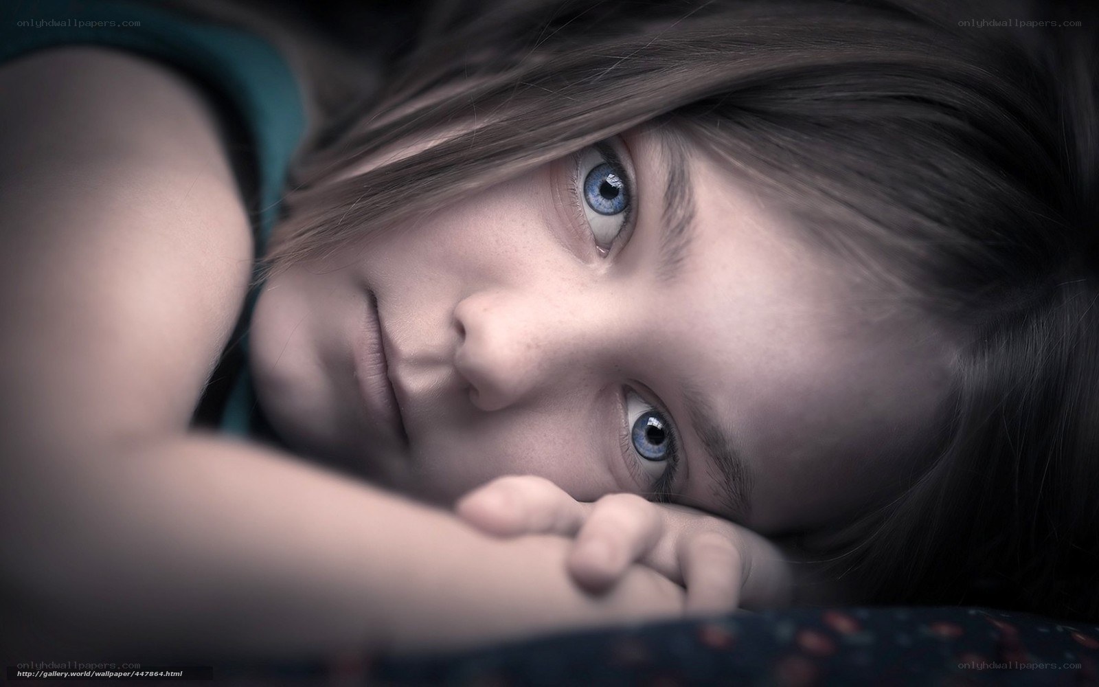 girl with blue eyes lying down