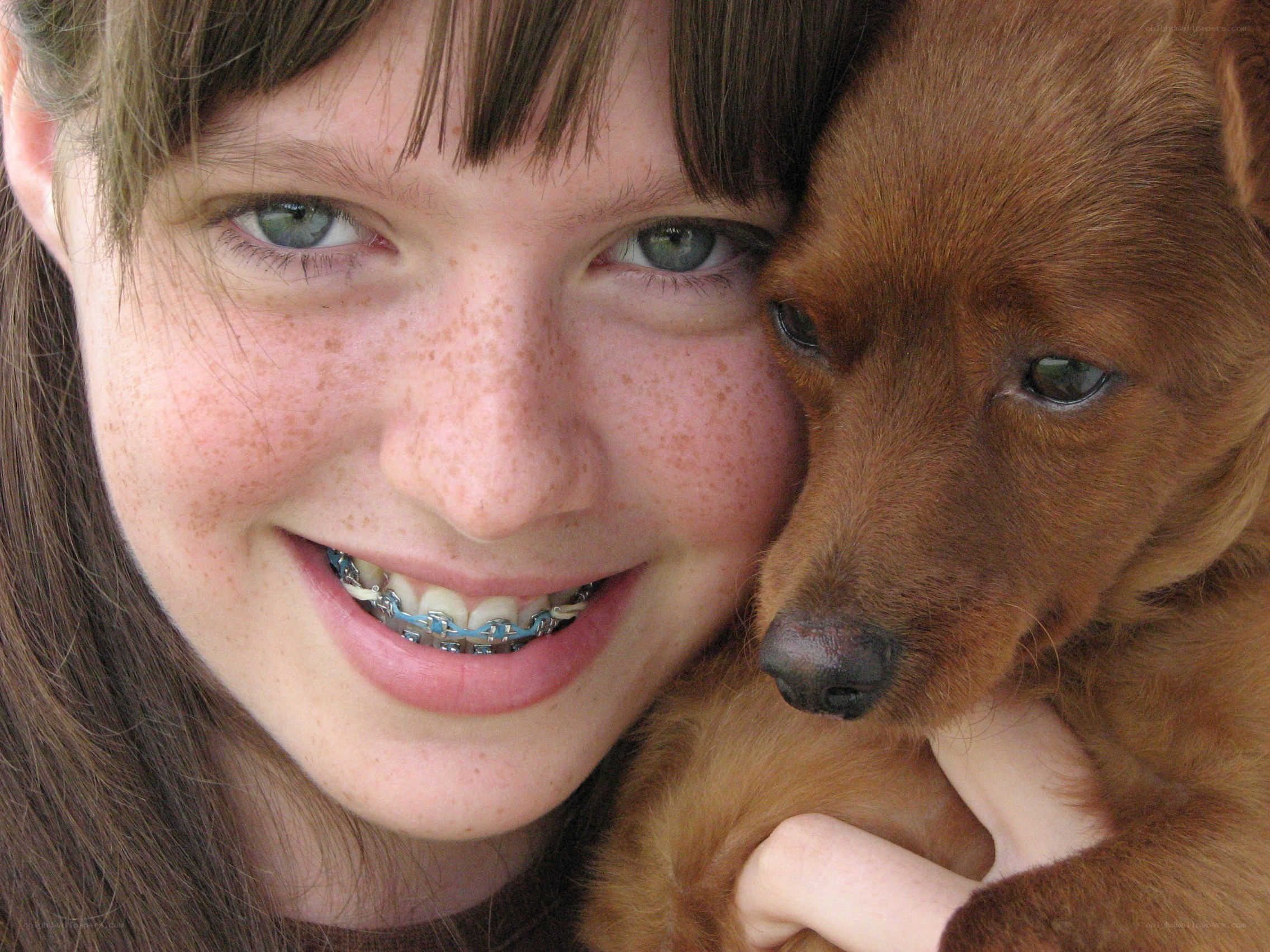 girl with braces and dog