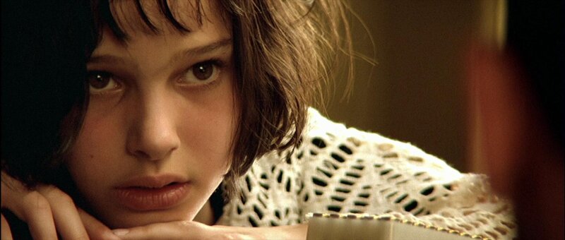 girl with brown hair looking at camera