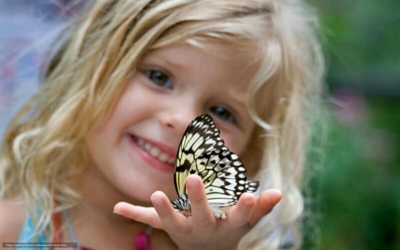 girl with butterfly on hand