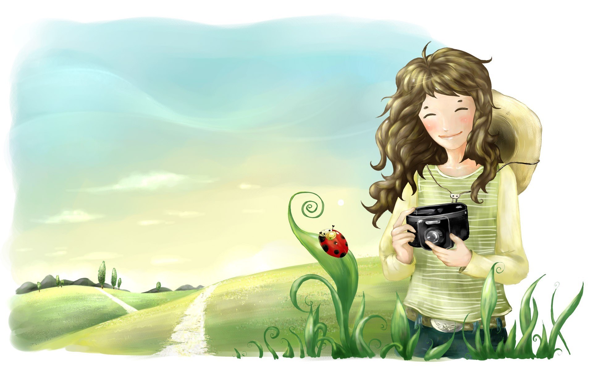 Girl with camera in field