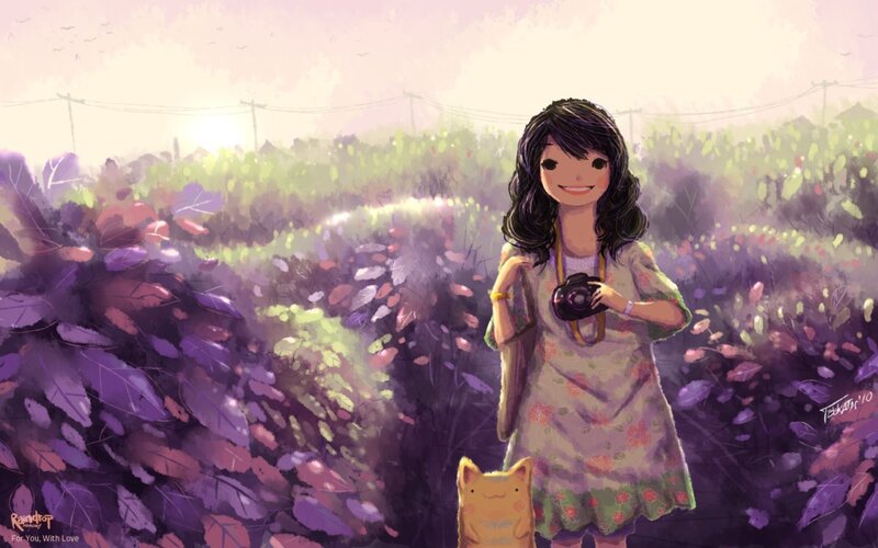 Girl with camera in flower field