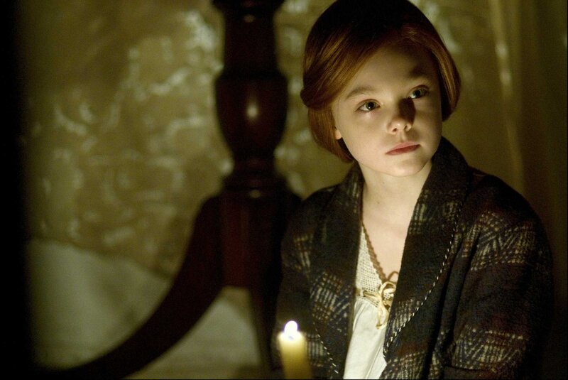 girl with candle in dim light