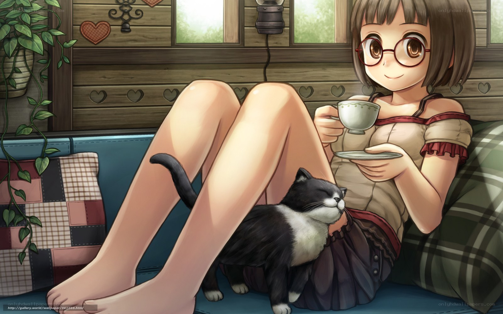 Girl with cat drinking tea