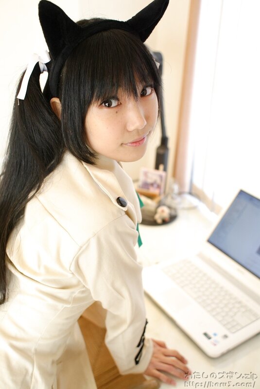 girl with cat ears at laptop