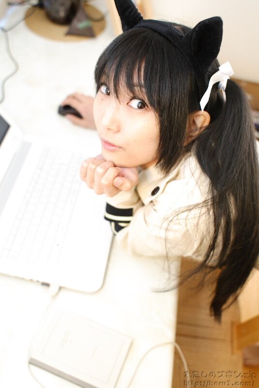 girl with cat ears at laptop