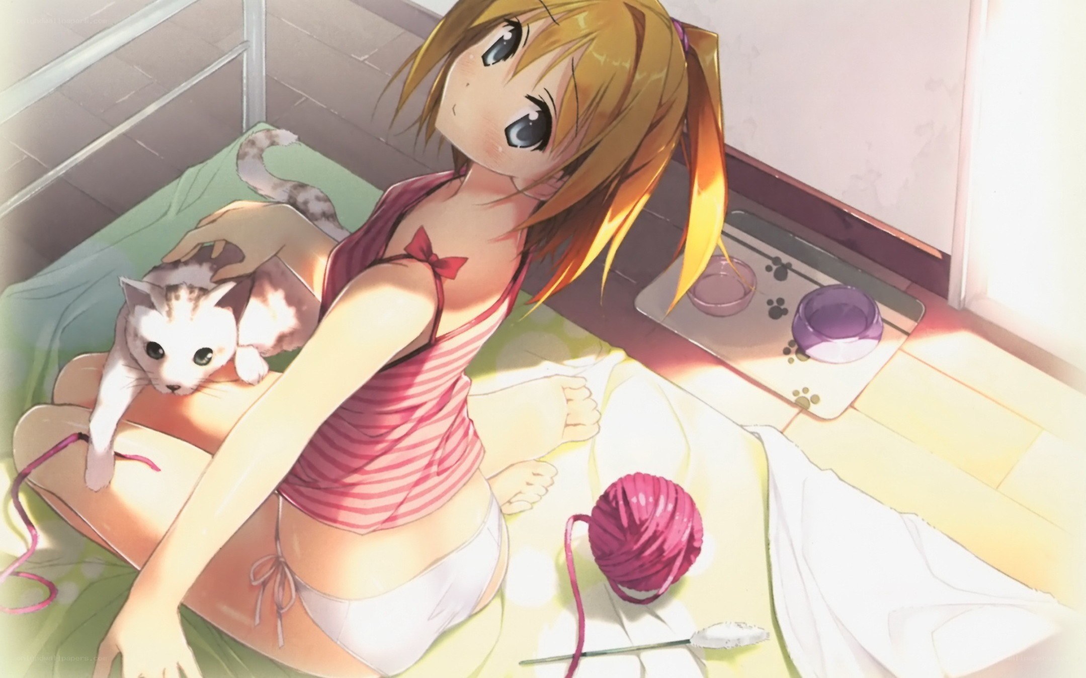 Girl with cat on bed