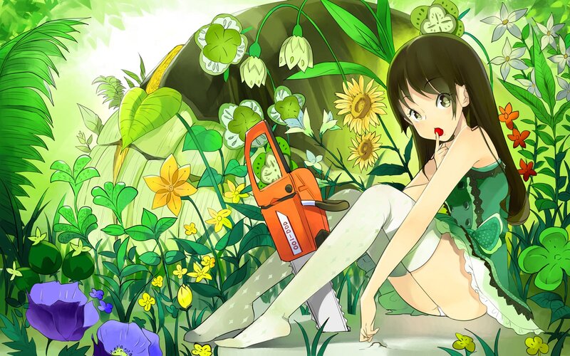 Girl with chainsaw in garden