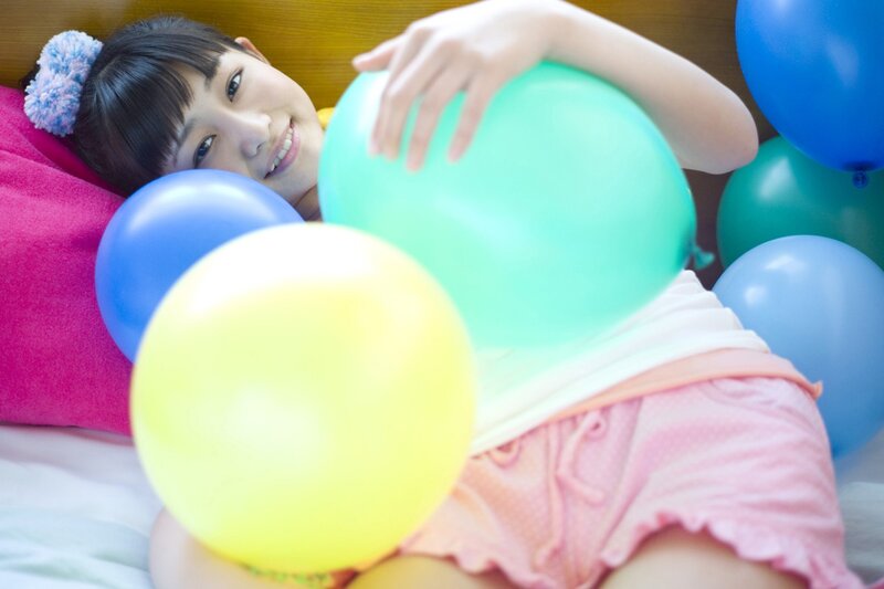 girl with colorful balloons
