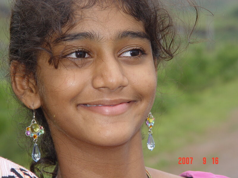 girl with colorful earrings