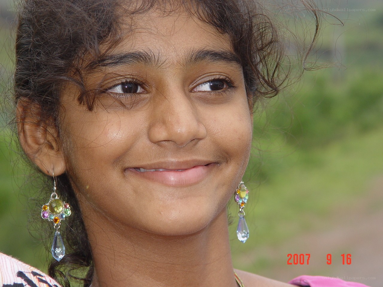 girl with colorful earrings