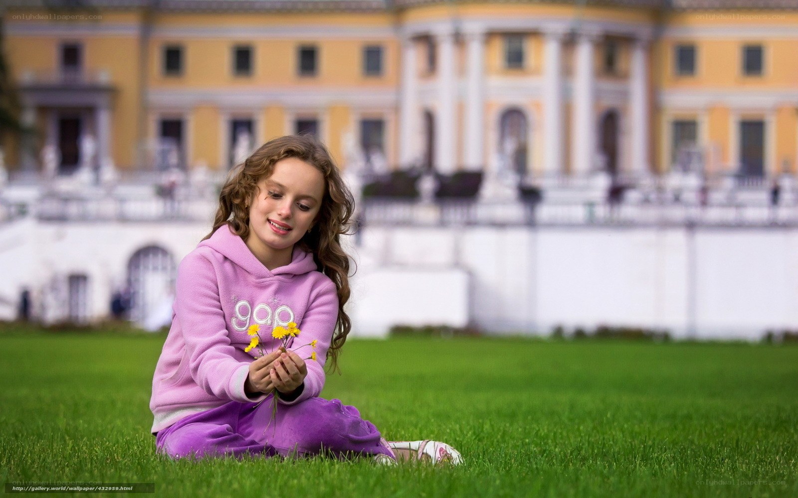 Girl with dandelions in park