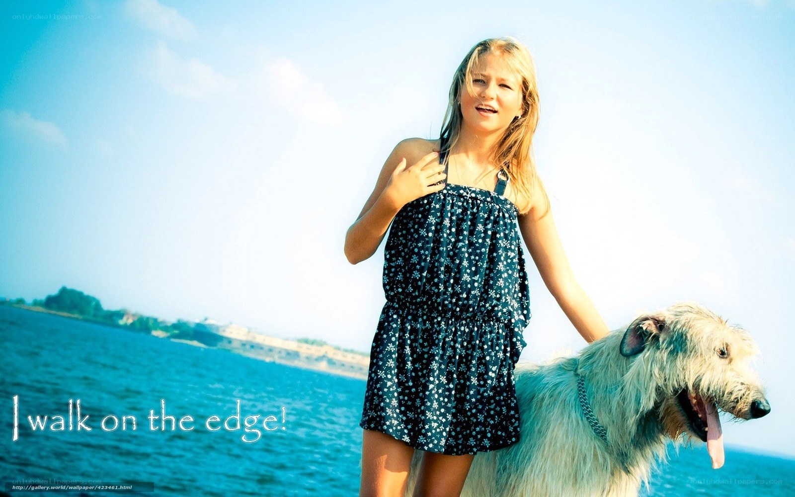 Girl with dog by the water