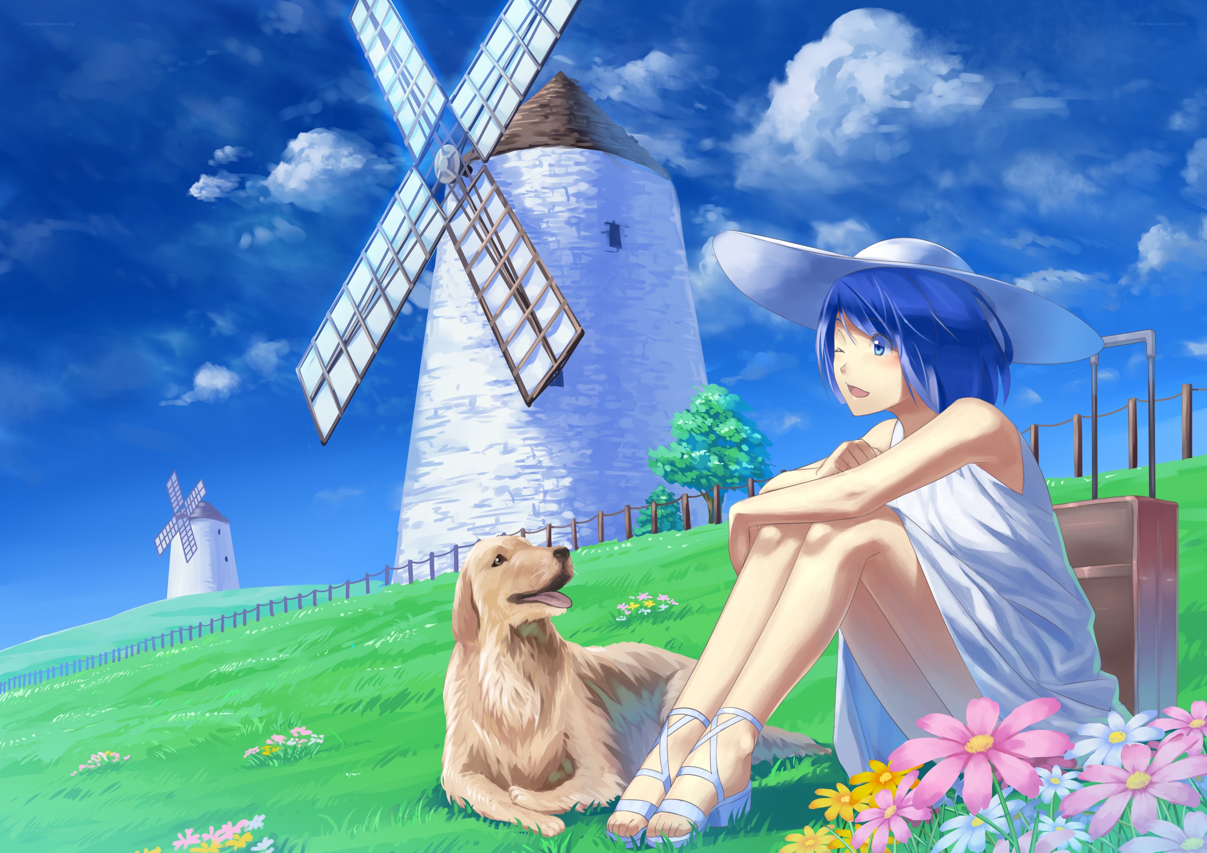 Girl with dog by windmill